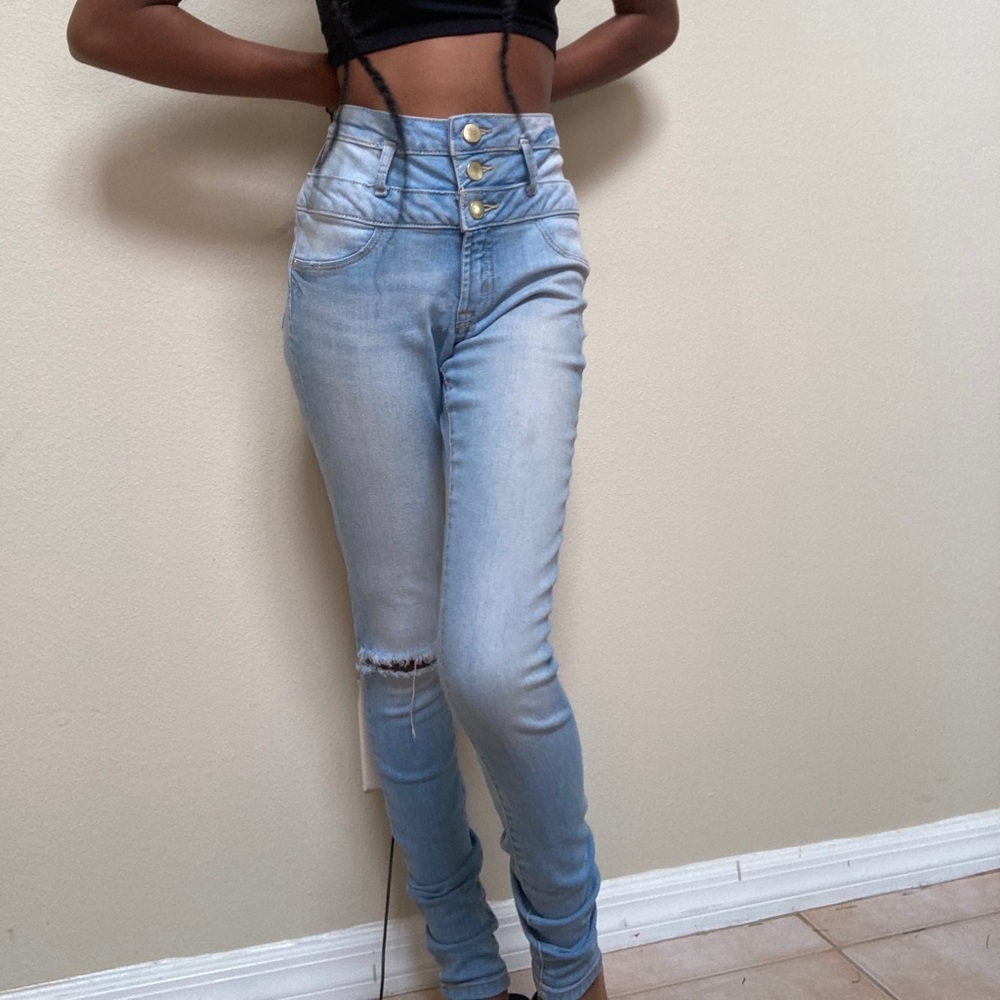 Light wash jeans with a rip :)